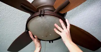 Ceiling fan repair and reinstallation on ceiling mount in Richmond, VA