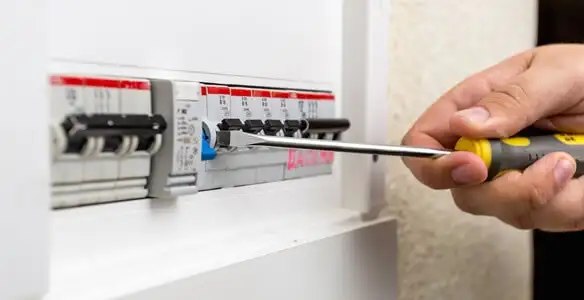electrical panel upgrade service showing technician adjusting circuit breakers during system upgrade in Richmond, VA