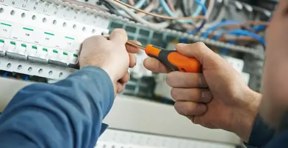 electrical service showing licensed electrician performing electrical panel maintenance and adjustments in Richmond, VA