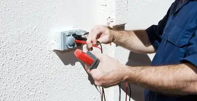 Electrician performing home electrical outlet and wiring inspection in Richmond, VA