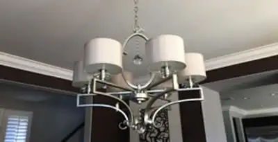 Modern chandelier installation with multiple light fixtures in Richmond, VA