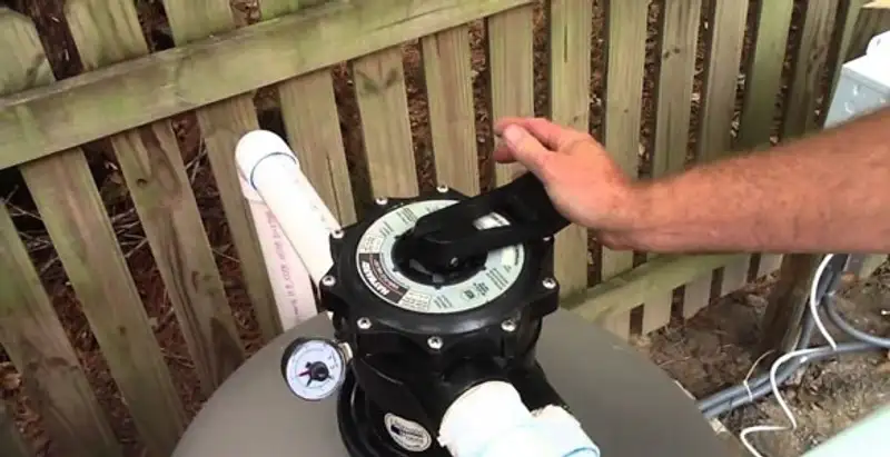 pool pumps service showing professional adjustment of pool pump control system in Richmond, VA