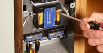 Whole home surge protection device being installed by a licensed electrician to protect electrical systems in Richmond, VA